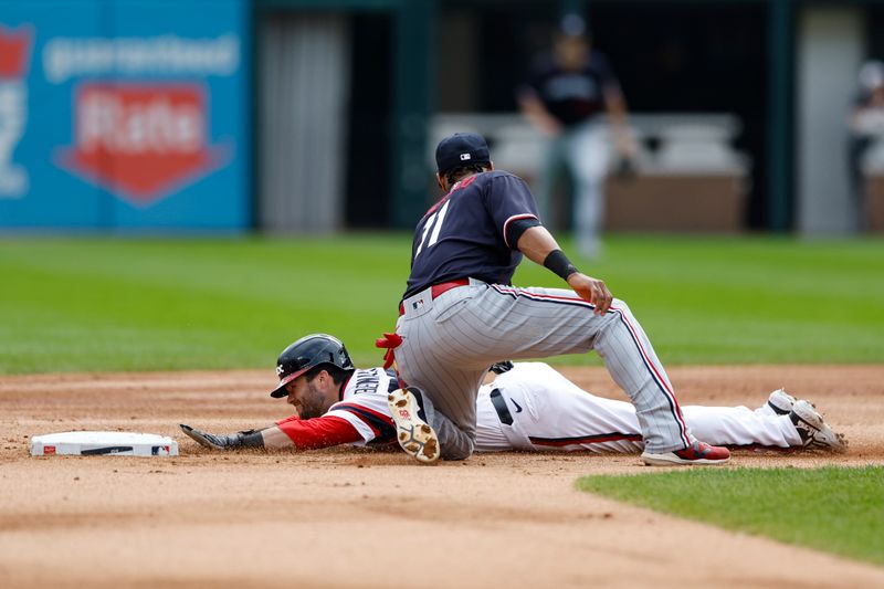 Sep 17, 2023; Chicago, Illinois, USA; Chicago White Sox left fielder Andrew Benintendi (23) is caught stealing second base by Minnesota Twins second baseman Jorge Polanco (11) during the first inning at Guaranteed Rate Field. Mandatory Credit: Kamil Krzaczynski-USA TODAY Sports