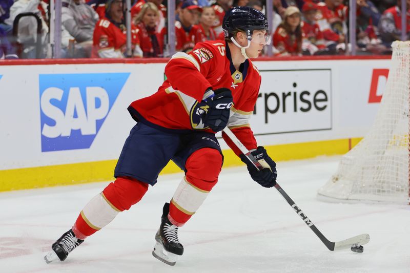 Apr 23, 2024; Sunrise, Florida, USA; Florida Panthers center Anton Lundell (15) moves the puck against the Tampa Bay Lightning during the first period in game two of the first round of the 2024 Stanley Cup Playoffs at Amerant Bank Arena. Mandatory Credit: Sam Navarro-USA TODAY Sports