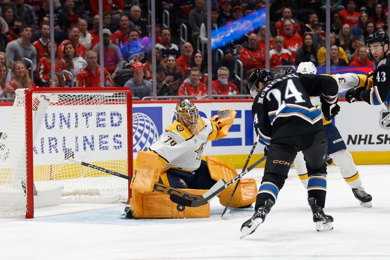 Nov 6, 2024; Washington, District of Columbia, USA; Washington Capitals center Connor McMichael (24) scores a goal on Nashville Predators goaltender Juuse Saros (74) in the first period at Capital One Arena. Mandatory Credit: Geoff Burke-Imagn Images