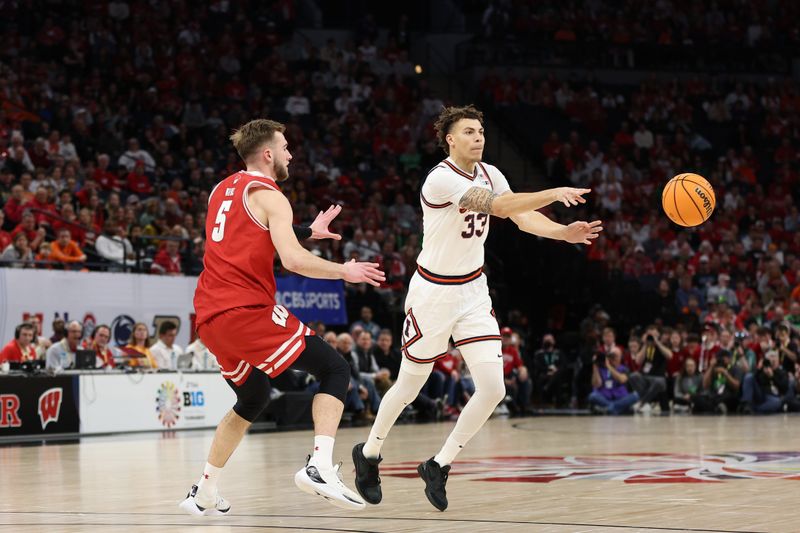 Mar 17, 2024; Minneapolis, MN, USA; Illinois Fighting Illini forward Coleman Hawkins (33) plays the ball defended by Illinois Fighting Illini guard AJ Redd (5) in the second half at Target Center. Mandatory Credit: Matt Krohn-USA TODAY Sports