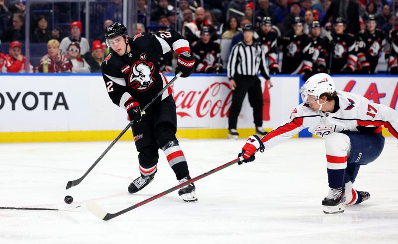 Apr 2, 2024; Buffalo, New York, USA;  Washington Capitals center Dylan Strome (17) tries to block a pass by Buffalo Sabres right wing Jack Quinn (22) during the second period at KeyBank Center. Mandatory Credit: Timothy T. Ludwig-USA TODAY Sports