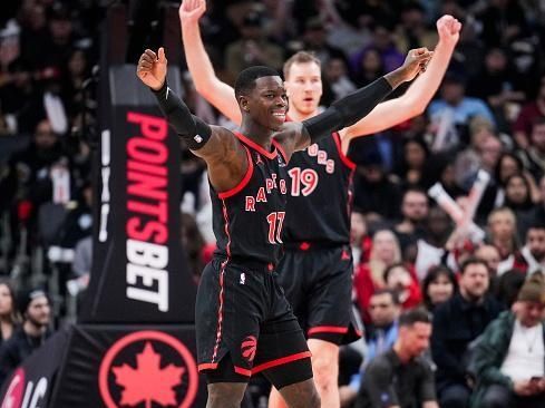 TORONTO, ON - DECEMBER 23: Dennis Schroder #17, Dennis Schroder #17 and Jakob Poeltl #19 of the Toronto Raptors look on against the Utah Jazz during the first half of their basketball game at the Scotiabank Arena on December 23, 2023 in Toronto, Ontario, Canada. NOTE TO USER: User expressly acknowledges and agrees that, by downloading and/or using this Photograph, user is consenting to the terms and conditions of the Getty Images License Agreement. (Photo by Mark Blinch/Getty Images)