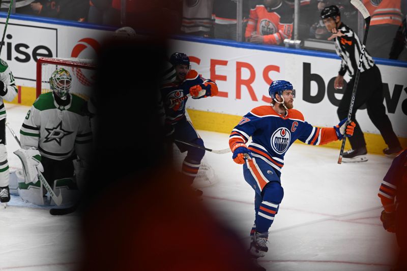 Jun 2, 2024; Edmonton, Alberta, CAN; Edmonton Oilers centre Connor McDavid (97) celebrates his goal on Dallas Stars goalie Jake Oettinger (29) during the first period in game six of the Western Conference Final of the 2024 Stanley Cup Playoffs at Rogers Place. Mandatory Credit: Walter Tychnowicz-USA TODAY Sports