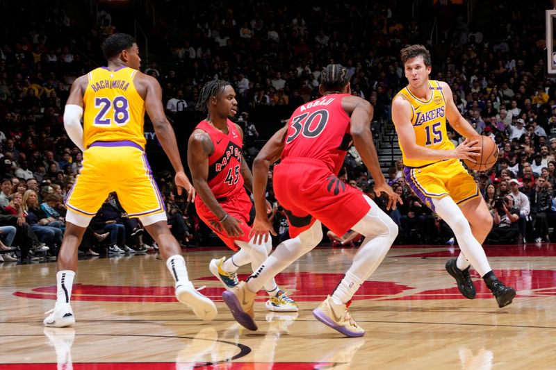 TORONTO, CANADA - NOVEMBER 1: Austin Reaves #15 of the Los Angeles Lakers handles the ball during the game against the Toronto Raptors on November 1, 2024 at the Scotiabank Arena in Toronto, Ontario, Canada.  NOTE TO USER: User expressly acknowledges and agrees that, by downloading and or using this Photograph, user is consenting to the terms and conditions of the Getty Images License Agreement.  Mandatory Copyright Notice: Copyright 2024 NBAE (Photo by Mark Blinch/NBAE via Getty Images)