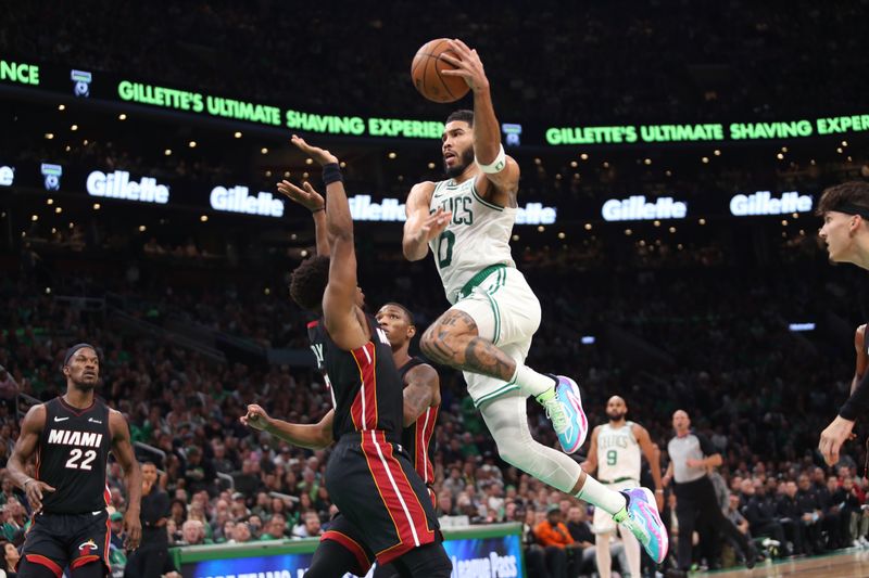 BOSTON, MASSACHUSETTS - OCTOBER 27: Jayson Tatum #0 of the Boston Celtics jumps for a basket over Kyle Lowry #7 of the Miami Heat during the second quarter at TD Garden on October 27, 2023 in Boston, Massachusetts. NOTE TO USER: User expressly acknowledges and agrees that, by downloading and or using this photograph, User is consenting to the terms and conditions of the Getty Images License Agreement. (Photo by Maddie Schroeder/Getty Images)