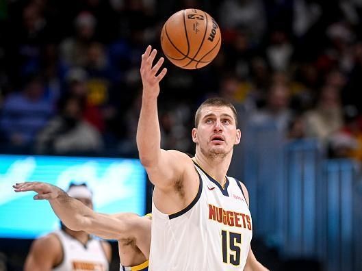 DENVER, CO - DECEMBER 25: Nikola Jokic (15) of the Denver Nuggets handles the ball against the Golden State Warriors during the second quarter at Ball Arena in Denver on Monday, December 25, 2023. (Photo by AAron Ontiveroz/The Denver Post)