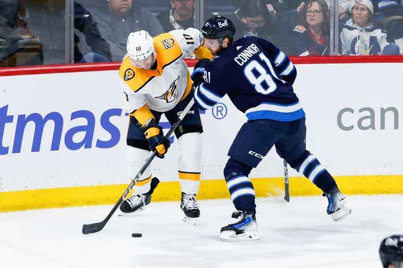 Mar 13, 2024; Winnipeg, Manitoba, CAN; Nashville Predators forward Colton Sissons (10) and Winnipeg Jets forward Kyle Connor (81) battle for the puck during the third period at Canada Life Centre. Mandatory Credit: Terrence Lee-USA TODAY Sports