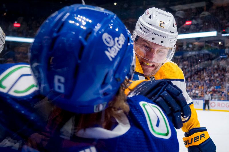 Apr 23, 2024; Vancouver, British Columbia, CAN; Nashville Predators defenseman Luke Schenn (2) checks Vancouver Canucks forward Brock Boeser (6) during the first period in game two of the first round of the 2024 Stanley Cup Playoffs at Rogers Arena. Mandatory Credit: Bob Frid-USA TODAY Sports