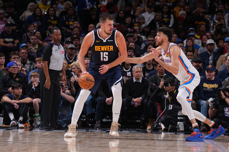 DENVER, CO - NOVEMBER 6: Nikola Jokic #15 of the Denver Nuggets dribbles the ball during the game against the Oklahoma City Thunder  during a regular season game on November 6, 2024 at Ball Arena in Denver, Colorado. NOTE TO USER: User expressly acknowledges and agrees that, by downloading and/or using this Photograph, user is consenting to the terms and conditions of the Getty Images License Agreement. Mandatory Copyright Notice: Copyright 2024 NBAE (Photo by Bart Young/NBAE via Getty Images)