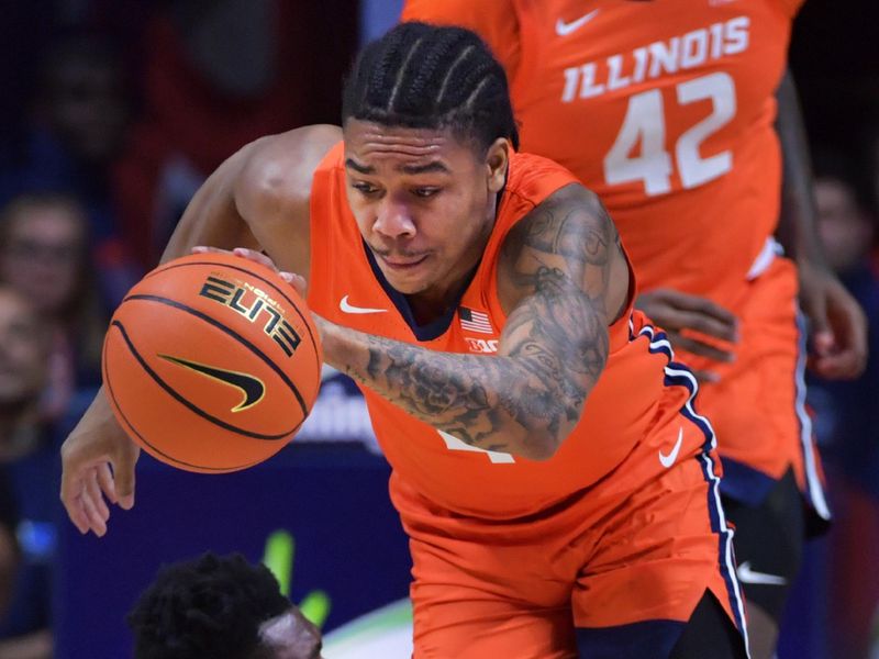 Jan 11, 2024; Champaign, Illinois, USA;  Illinois Fighting Illini guard Justin Harmon (4) steals the ball from Michigan State Spartans center Mady Sissoko (22) during the first half at State Farm Center. Mandatory Credit: Ron Johnson-USA TODAY Sports