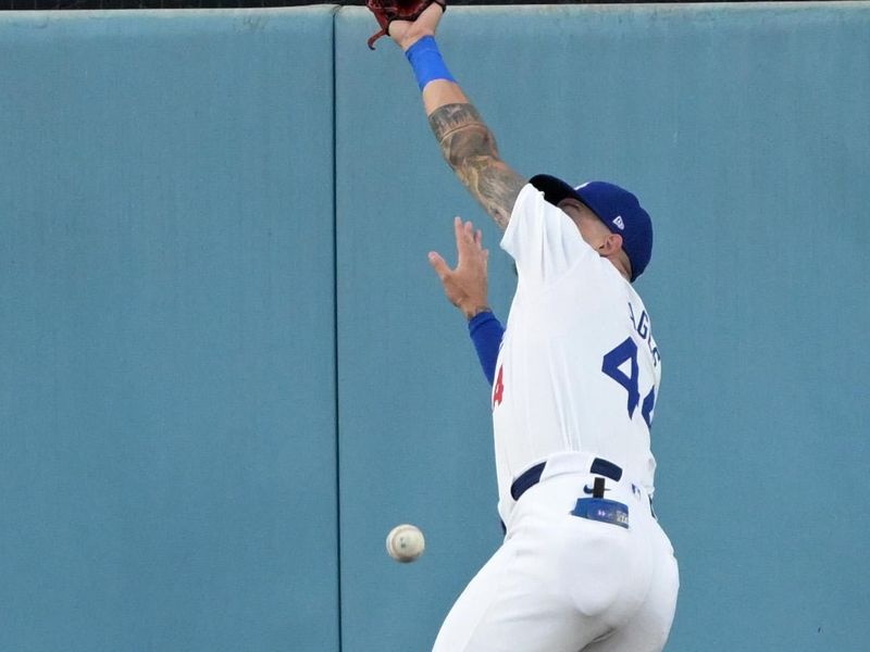 Aug 5, 2024; Los Angeles, California, USA;  Los Angeles Dodgers center fielder Andy Pages (44) reaches for the ball on a triple by Philadelphia Phillies right fielder Nick Castellanos (8) in the second inning at Dodger Stadium. Mandatory Credit: Jayne Kamin-Oncea-USA TODAY Sports