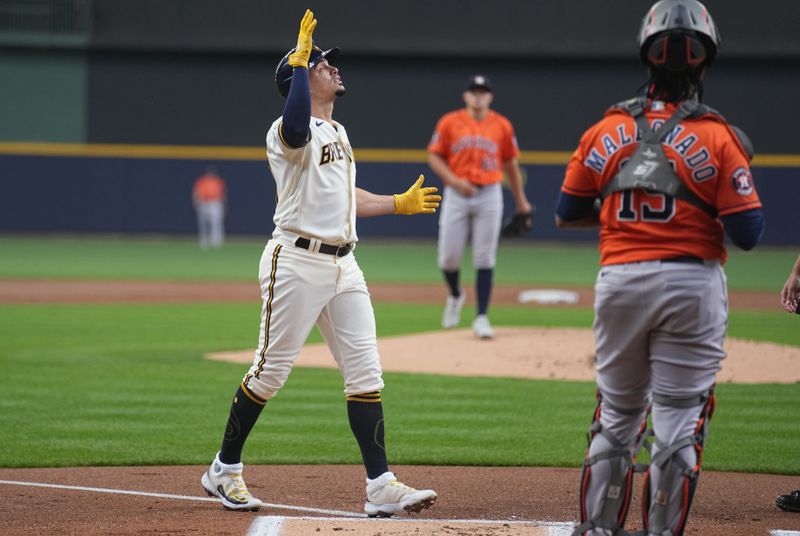 May 24, 2023; Milwaukee, Wisconsin, USA; Milwaukee Brewers shortstop Willy Adames (27) comes across home plate after hitting a two-run home run during the first inning of their game against the Houston Astros at American Family Field. Mandatory Credit: Mark Hoffman-USA TODAY Sports