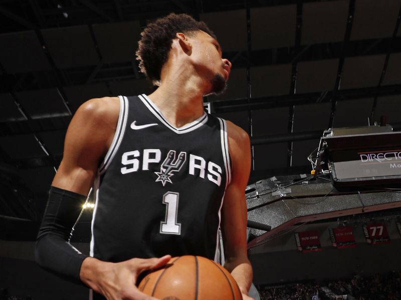 PORTLAND, OR - DECEMBER 13: Victor Wembanyama #1 of the San Antonio Spurs looks on during the game against the Portland Trail Blazers on December 13, 2024 at the Moda Center Arena in Portland, Oregon. NOTE TO USER: User expressly acknowledges and agrees that, by downloading and or using this photograph, user is consenting to the terms and conditions of the Getty Images License Agreement. Mandatory Copyright Notice: Copyright 2024 NBAE (Photo by Cameron Browne/NBAE via Getty Images)