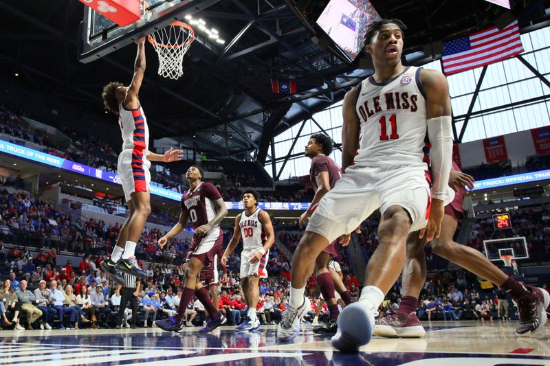 Feb 18, 2023; Oxford, Mississippi, USA; Mississippi Rebels forward Jaemyn Brakefield (4) scores off an assist by Mississippi Rebels guard Matthew Murrell (11) during the second half at The Sandy and John Black Pavilion at Ole Miss. Mandatory Credit: Petre Thomas-USA TODAY Sports