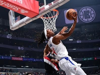 LOS ANGELES, CA - DECEMBER 11: Terance Mann #14 of the LA Clippers drives to the basket during the game against the Portland Trail Blazers on December 11, 2023 at Crypto.Com Arena in Los Angeles, California. NOTE TO USER: User expressly acknowledges and agrees that, by downloading and/or using this Photograph, user is consenting to the terms and conditions of the Getty Images License Agreement. Mandatory Copyright Notice: Copyright 2023 NBAE (Photo by Adam Pantozzi/NBAE via Getty Images)