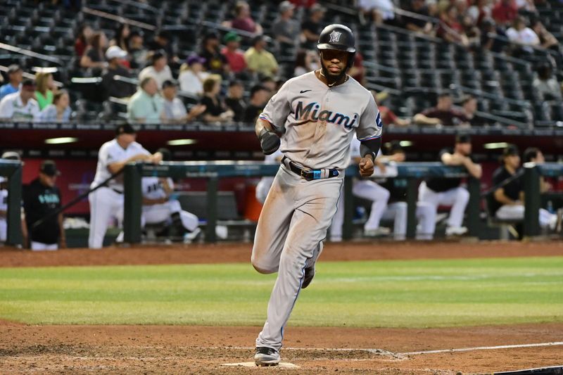 May 10, 2023; Phoenix, Arizona, USA; Miami Marlins right fielder Jesus Sanchez (7) scores in the ninth inning against the Arizona Diamondbacks at Chase Field. Mandatory Credit: Matt Kartozian-USA TODAY Sports