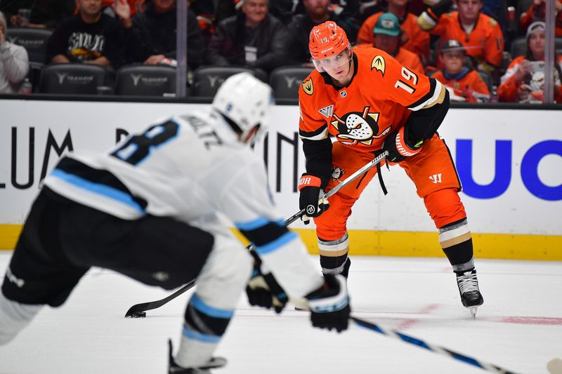 Oct 16, 2024; Anaheim, California, USA; Anaheim Ducks right wing Troy Terry (19) controls the puck against Utah Hockey Club during the overtime period at Honda Center. Mandatory Credit: Gary A. Vasquez-Imagn Images