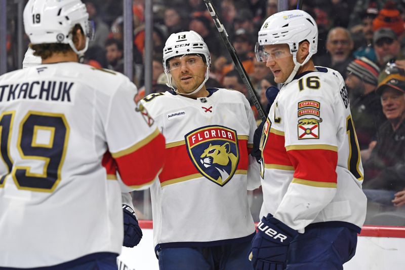 Dec 5, 2024; Philadelphia, Pennsylvania, USA; Florida Panthers center Aleksander Barkov (16) celebrates his goal with center Sam Reinhart (13) against the Philadelphia Flyers eduring the second period at Wells Fargo Center. Mandatory Credit: Eric Hartline-Imagn Images