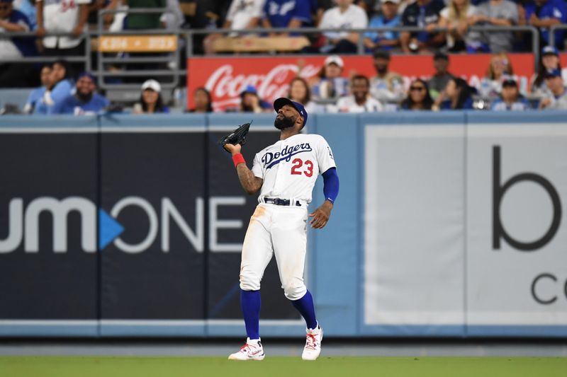 Aug 12, 2023; Los Angeles, California, USA; Los Angeles Dodgers right fielder Jason Heyward (23) makes a catch against the Colorado Rockies during the seventh inning at Dodger Stadium. Mandatory Credit: Jonathan Hui-USA TODAY Sports