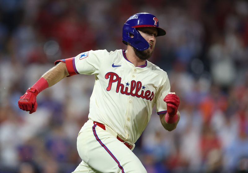 Oct 5, 2024; Philadelphia, PA, USA; Philadelphia Phillies pinch hitter Kody Clemens (2) hits a RBI double against the New York Mets in the ninth inning  in game one of the NLDS for the 2024 MLB Playoffs at Citizens Bank Park. Mandatory Credit: Bill Streicher-Imagn Images