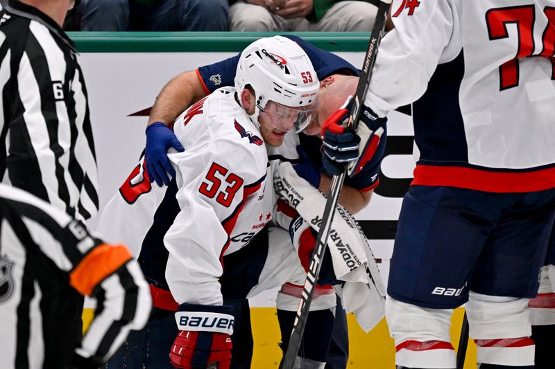 Oct 28, 2025; Dallas, Texas, USA; Washington Capitals center Ethen Frank (53) is helped off the ice during the third period against the Dallas Stars at the American Airlines Center. Mandatory Credit: Jerome Miron-Imagn Images
