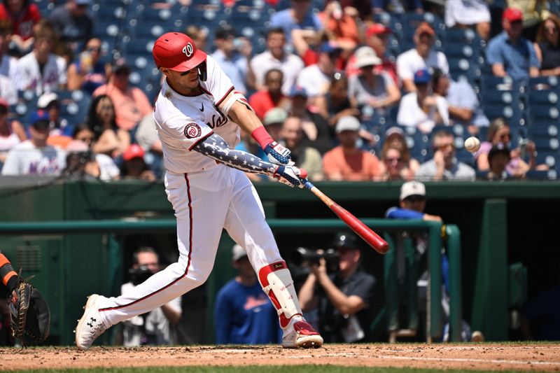 Jul 4, 2024; Washington, District of Columbia, USA; Washington Nationals first baseman Joey Meneses (45) hits the ball into play against the New York Mets during the fourth inning at Nationals Park. Mandatory Credit: Rafael Suanes-USA TODAY Sports