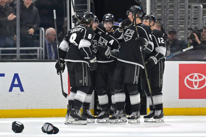 Mar 3, 2024; Los Angeles, California, USA; Los Angeles Kings center Phillip Danault (24), center, is congratulated after scoring a hat trick in the third period against the New Jersey Devils at Crypto.com Arena. Mandatory Credit: Jayne Kamin-Oncea-USA TODAY Sports