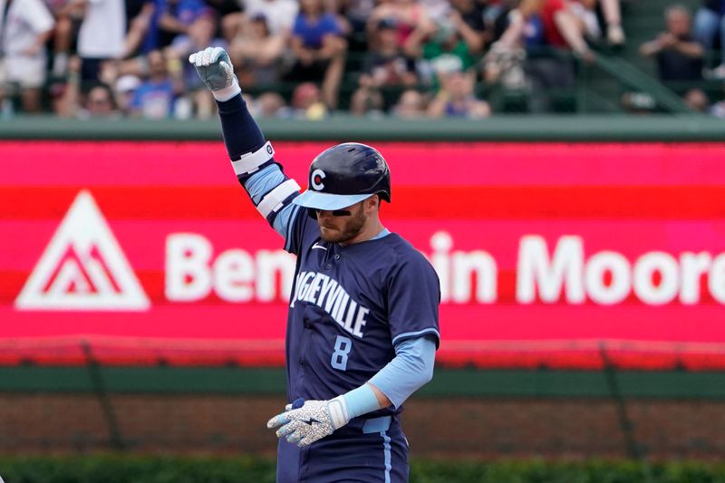 Jul 5, 2024; Chicago, Illinois, USA; Chicago Cubs outfielder Ian Happ (8) gestures after hitting a one run double against the Los Angeles Angels during the fifth inning at Wrigley Field. Mandatory Credit: David Banks-USA TODAY Sports