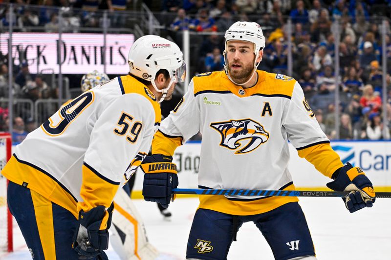 Nov 24, 2023; St. Louis, Missouri, USA;  Nashville Predators center Ryan O'Reilly (90) talks with defenseman Roman Josi (59) before a face off against the St. Louis Blues during the second period at Enterprise Center. Mandatory Credit: Jeff Curry-USA TODAY Sports