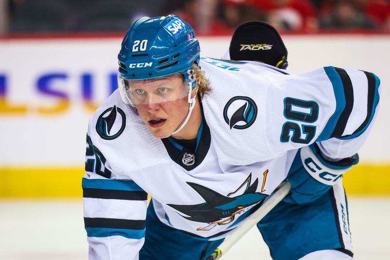 Apr 18, 2024; Calgary, Alberta, CAN; San Jose Sharks left wing Fabian Zetterlund (20) during the face off against the Calgary Flames during the first period at Scotiabank Saddledome. Mandatory Credit: Sergei Belski-USA TODAY Sports