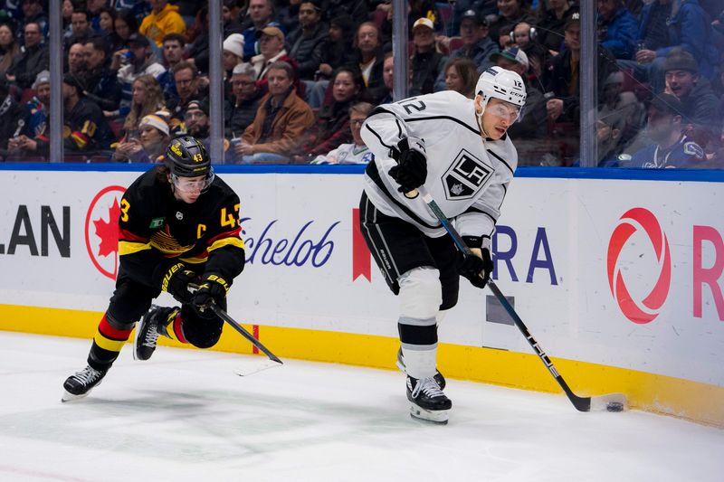 Feb 29, 2024; Vancouver, British Columbia, CAN; Vancouver Canucks defenseman Quinn Hughes (43) pursues Los Angeles Kings forward Trevor Moore (12) in the second period at Rogers Arena. Mandatory Credit: Bob Frid-USA TODAY Sports