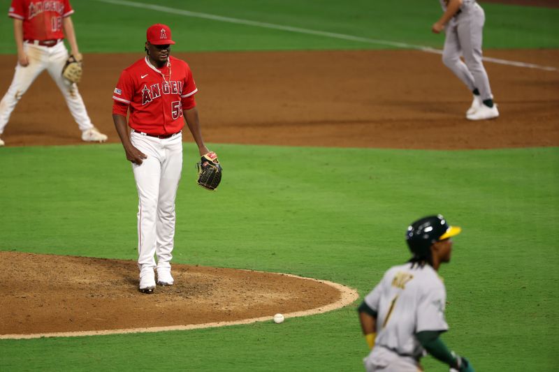 Sep 30, 2023; Anaheim, California, USA; Los Angeles Angels pitcher Jose Soriano (59) reacts after committing a balk with the bases loaded advancing Oakland Athletics center fielder Esteury Ruiz (1) and scoring the game tying run during the eighth inning at Angel Stadium. Mandatory Credit: Kiyoshi Mio-USA TODAY Sports