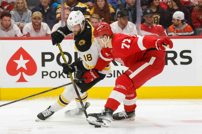 Nov 23, 2024; Detroit, Michigan, USA; Boston Bruins center Pavel Zacha (18) and Detroit Red Wings defenseman Simon Edvinsson (77) fights for control of the puck during the third period at Little Caesars Arena. Mandatory Credit: Brian Bradshaw Sevald-Imagn Images