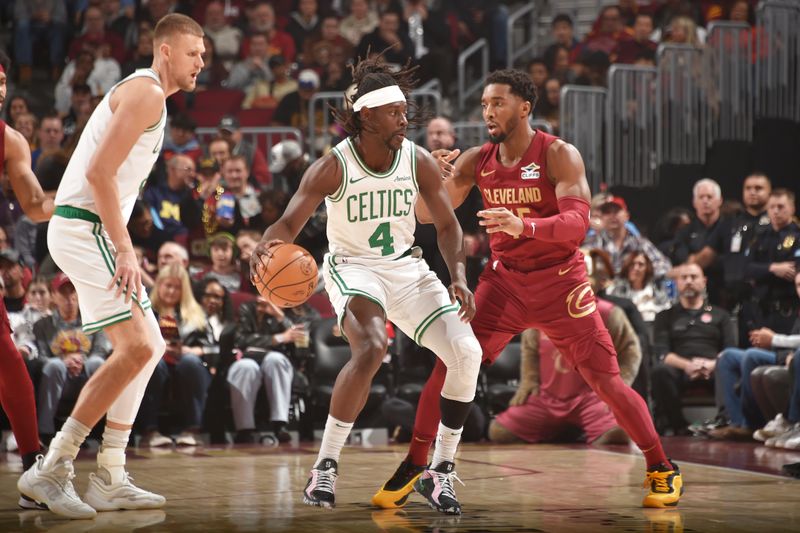 CLEVELAND, OH - DECEMBER 1: Jrue Holiday #4 of the Boston Celtics dribbles the ball during the game against the Cleveland Cavaliers on December 1, 2024 at Rocket Mortgage FieldHouse in Cleveland, Ohio. NOTE TO USER: User expressly acknowledges and agrees that, by downloading and/or using this Photograph, user is consenting to the terms and conditions of the Getty Images License Agreement. Mandatory Copyright Notice: Copyright 2024 NBAE (Photo by David Liam Kyle/NBAE via Getty Images)