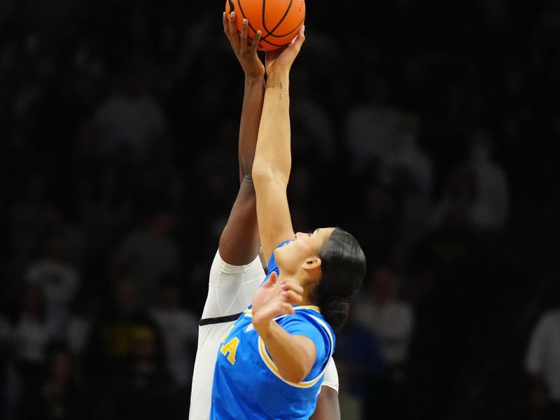 Jan 19, 2024; Boulder, Colorado, USA; UCLA Bruins center Lauren Betts (51) and Colorado Buffaloes center Aaronette Vonleh (21) reach for the tip off in the first quarter at the CU Events Center. Mandatory Credit: Ron Chenoy-USA TODAY Sports
\v11