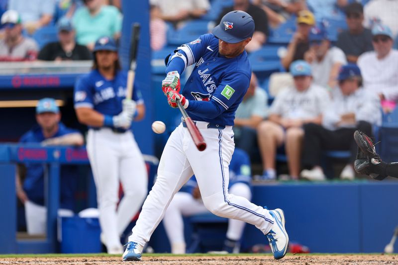 Mar 13, 2026; Dunedin, Florida, USA; Toronto Blue Jays center fielder Daulton Varsho (5) hit a three run home run against the Minnesota Twins in the fifth inning during spring training at TD Ballpark. Mandatory Credit: Nathan Ray Seebeck-Imagn Images