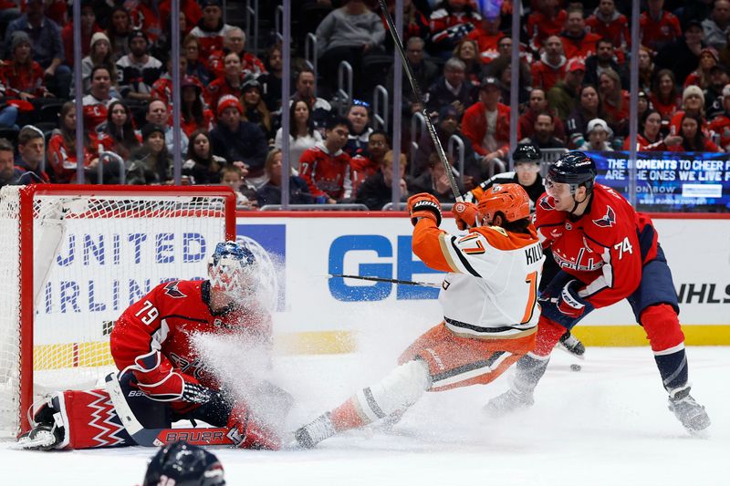 Jan 5, 2026; Washington, District of Columbia, USA; Anaheim Ducks left wing Alex Killorn (17) is hooked by Washington Capitals defenseman John Carlson (74) while attempting a shot on Capitals goaltender Charlie Lindgren (79) during the second period at Capital One Arena. Mandatory Credit: Geoff Burke-Imagn Images