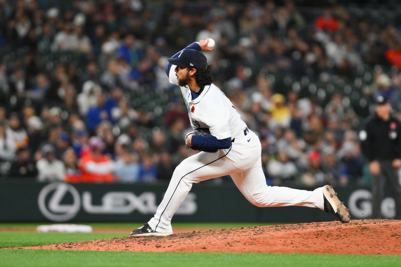 May 27, 2024; Seattle, Washington, USA; Seattle Mariners relief pitcher Andres Munoz (75) pitches to the Houston Astros during the ninth inning at T-Mobile Park. Mandatory Credit: Steven Bisig-USA TODAY Sports