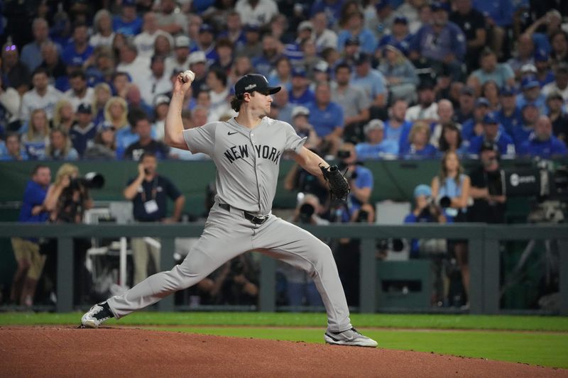 Oct 10, 2024; Kansas City, Missouri, USA; New York Yankees pitcher Gerrit Cole (45) throws a pitch during the first inning against the Kansas City Royals during game four of the ALDS for the 2024 MLB Playoffs at Kauffman Stadium. Mandatory Credit: Denny Medley-Imagn Images