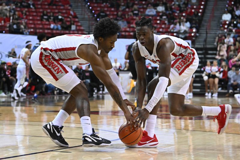 Feb 14, 2023; Las Vegas, Nevada, USA; UNLV Runnin' Rebels guard Shane Nowell (3) and forward Victor Iwuakor (0) scramble for a loose ball against the San Jose State Spartans in the second half at Thomas & Mack Center. Mandatory Credit: Candice Ward-USA TODAY Sports