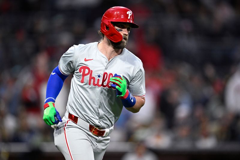 Apr 26, 2024; San Diego, California, USA; Philadelphia Phillies first baseman Bryce Harper (3) rounds the bases after hitting a home run against the San Diego Padres during the third inning at Petco Park. Mandatory Credit: Orlando Ramirez-USA TODAY Sports