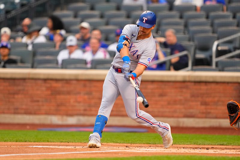 Aug 30, 2023; New York City, New York, USA;  Texas Rangers first baseman Nathaniel Lowe (30) hits a single against the New York Mets during the first inning at Citi Field. Mandatory Credit: Gregory Fisher-USA TODAY Sports