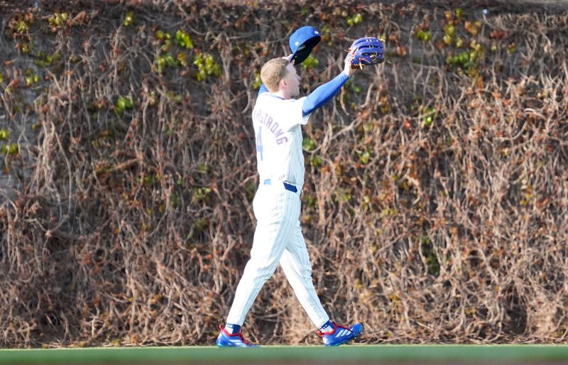 Apr 27, 2025; Chicago, Illinois, USA; Chicago Cubs outfielder Pete Crow-Armstrong (4) waves to the crowd in the bleachers during a game against the Philadelphia Phillies at Wrigley Field. Mandatory Credit: David Banks-Imagn Images
