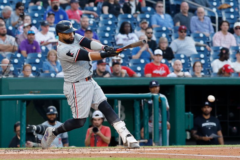 May 21, 2024; Washington, District of Columbia, USA; Minnesota Twins first base Carlos Santana (30) grounds into an RBI double play against the Washington Nationals during the second inning at Nationals Park. Mandatory Credit: Geoff Burke-USA TODAY Sports