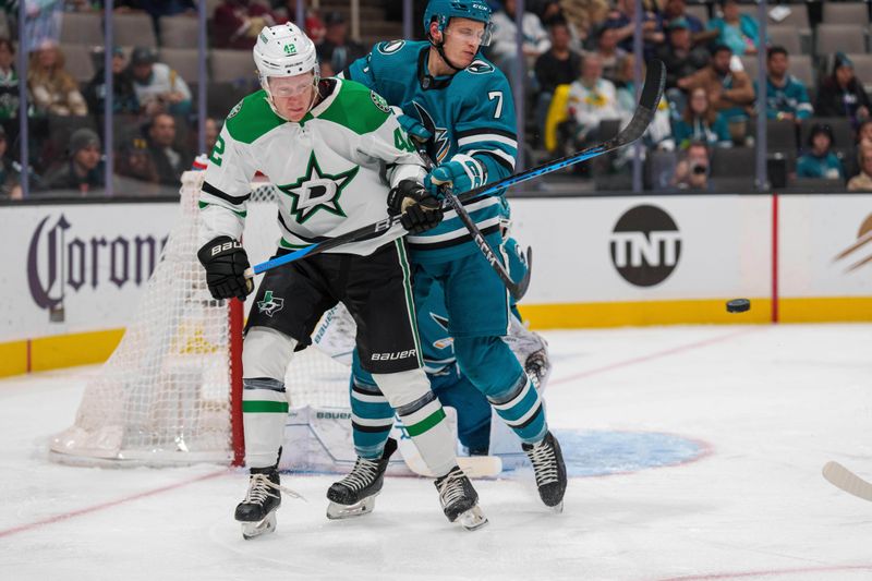 Jan 18, 2023; San Jose, California, USA; San Jose Sharks center Nico Sturm (7) and Dallas Stars left wing Fredrik Olofsson (42) battle for position in front of the net during the first period at SAP Center at San Jose. Mandatory Credit: Neville E. Guard-USA TODAY Sports