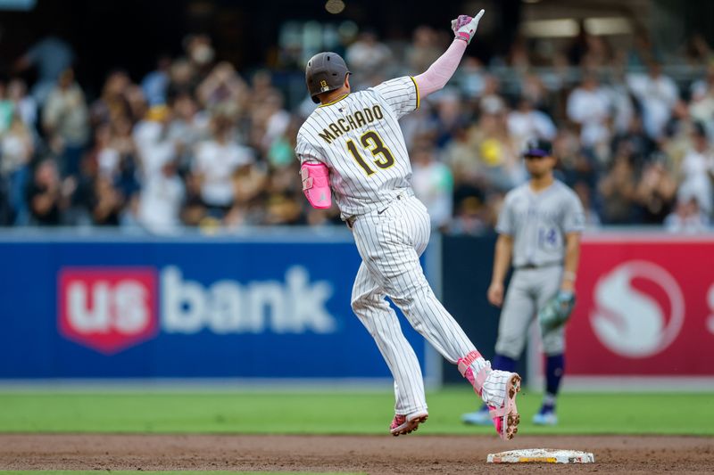 Sep 13, 2025; San Diego, California, USA; San Diego Padres third baseman Manny Machado (13) celebrates after hitting a one run home run during the third inning against the Colorado Rockies at Petco Park. Mandatory Credit: David Frerker-Imagn Images