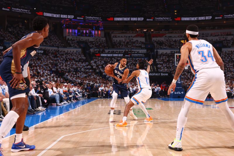 OKLAHOMA CITY, OK - APRIL 21:  CJ McCollum #3 of the New Orleans Pelicans handles the ball during the game  against the Oklahoma City Thunder during Round 1 Game 1 of the 2024 NBA Playoffs on April 21, 2024 at Paycom Arena in Oklahoma City, Oklahoma. NOTE TO USER: User expressly acknowledges and agrees that, by downloading and or using this photograph, User is consenting to the terms and conditions of the Getty Images License Agreement. Mandatory Copyright Notice: Copyright 2024 NBAE (Photo by Zach Beeker/NBAE via Getty Images)