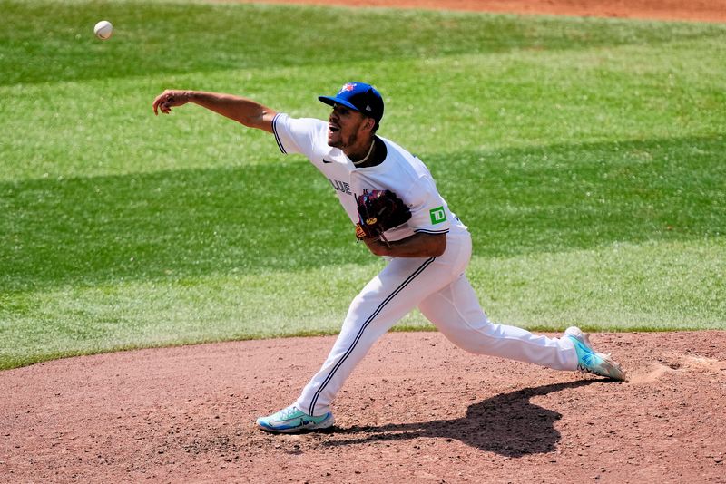 Jul 28, 2024; Toronto, Ontario, CAN; Toronto Blue Jays starting pitcher Jose Berrios (17) pitches to the Texas Rangers during the sixth inning at Rogers Centre. Mandatory Credit: John E. Sokolowski-USA TODAY Sports