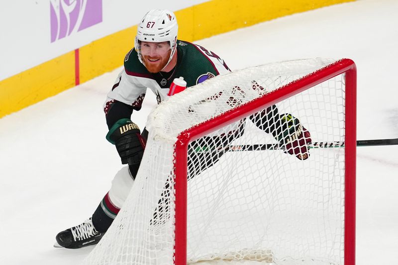 Nov 25, 2023; Las Vegas, Nevada, USA; Arizona Coyotes left wing Lawson Crouse (67) reacts after scoring an empty net goal against the Vegas Golden Knights during the third period at T-Mobile Arena. Mandatory Credit: Stephen R. Sylvanie-USA TODAY Sports