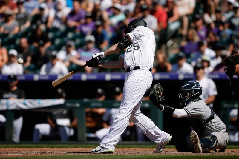 Jul 16, 2023; Denver, Colorado, USA; Colorado Rockies designated hitter C.J. Cron (25) hits a grand slam in the eighth inning against the New York Yankees at Coors Field. Mandatory Credit: Isaiah J. Downing-USA TODAY Sports